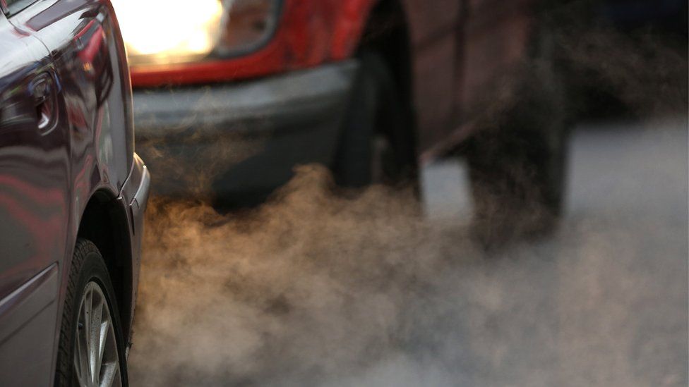 Cars emitting fumes