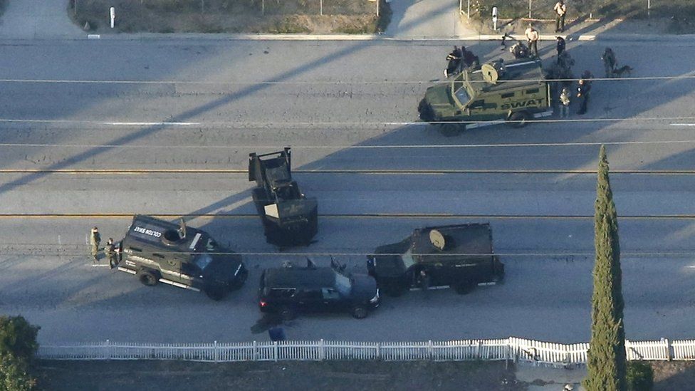An SUV with its windows shot out that police suspect was the getaway vehicle from at the scene of a shooting in San Bernardino, California is shown in this aerial photo December 2, 201