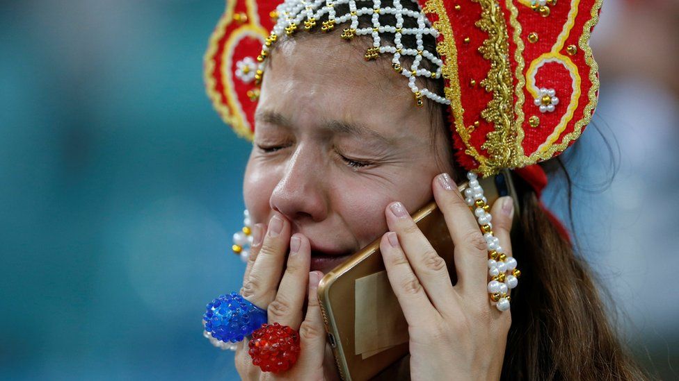 Russian fan cries at the end of the team's quarter-final match against Croatia, 7 July 2018