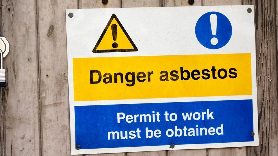 A sign warning of asbestos danger