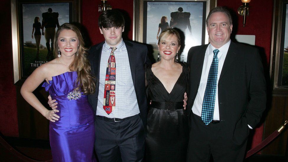 The Tuohys and their birth children at the movie premiere