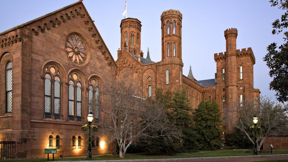 The Smithsonian Institution Building ("The Castle") in Washington, D.C., at dusk.
