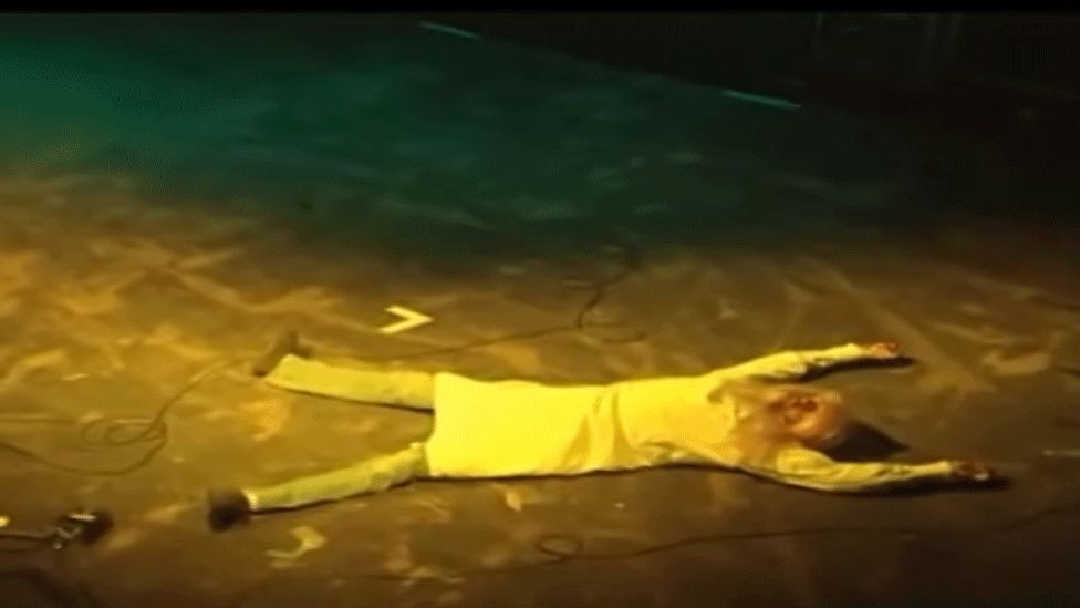 Kurt Cobain lying onstage at Reading Festival