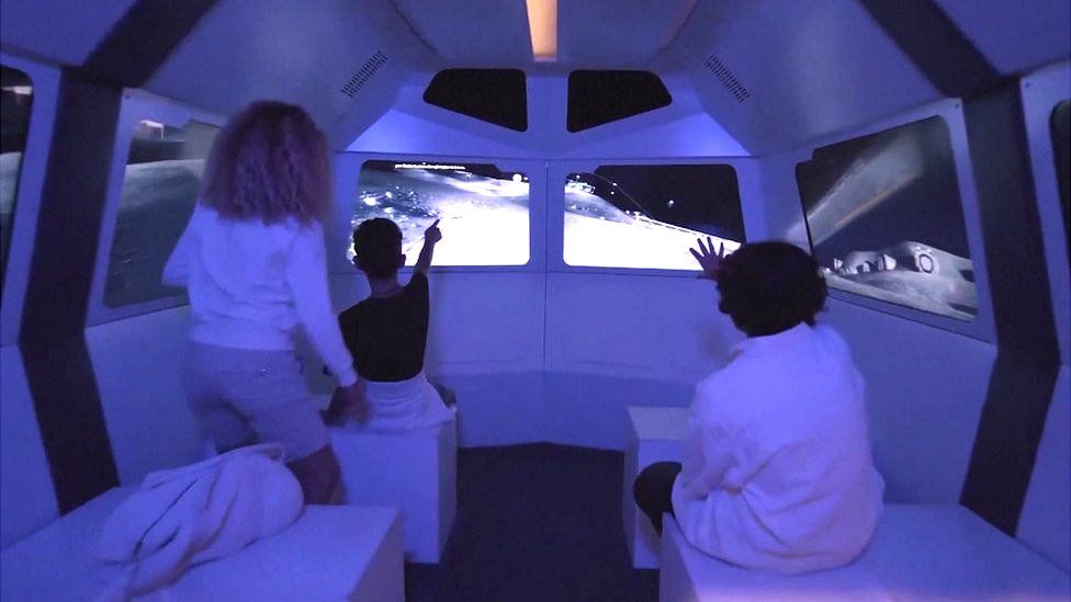 Children in space simulator capsule
