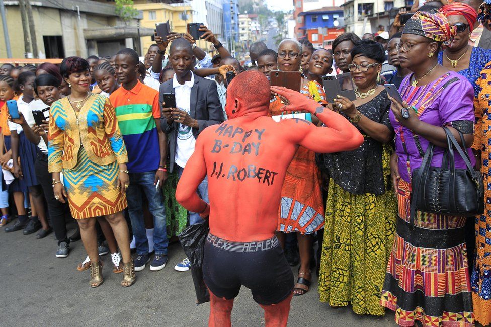 B-Day J.J. Robert" greeting painted on his body as he jons a parade in commemoration of the 208th birth anniversary of Liberia"s first (and sixth) President Joseph Jenkins Roberts in Monrovia, Liberia, 15 March 2017