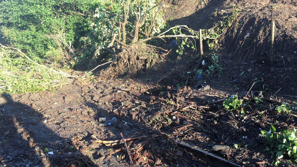 Picture of the train tracks covered in debris from a landslip