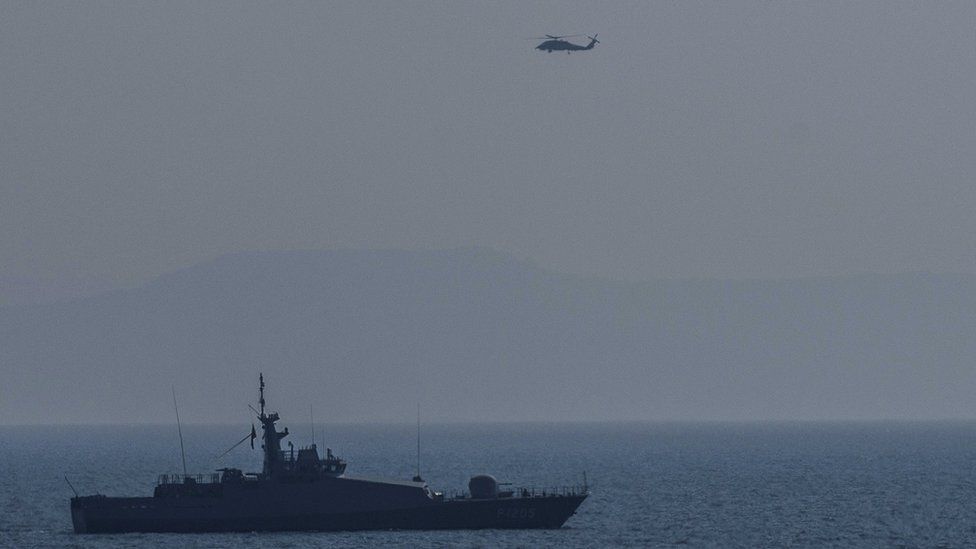 Turkish warship and helicopter patrol Aegean sea between Turkish coast and Lesbos island. 21 March 2016