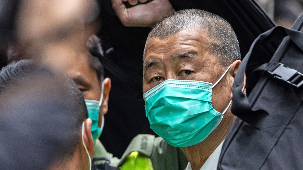 Media mogul Jimmy Lai is escorted out of a Correctional Services Department vehicle and into the Court of Final Appeal in Hong Kong, China, 09 February 2021
