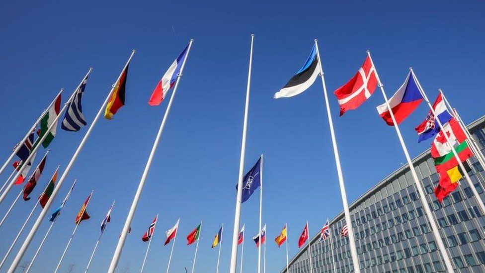 An empty flag pole stands between flags of NATO members waiting for the raising ceremony for Finland's accession to NATO outside the NATO headquarters, ahead of NATO Foreign Ministers meeting at Alliance headquarters in Brussels, Belgium, 03 April 2023