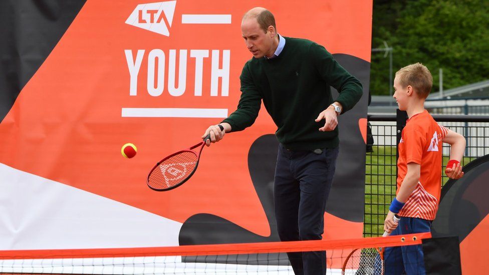 Prince William playing tennis