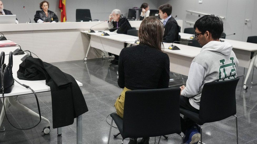 British man Aditya Verma, wearing a grey hoodie, attends his trial at Spain's National Court in Madrid