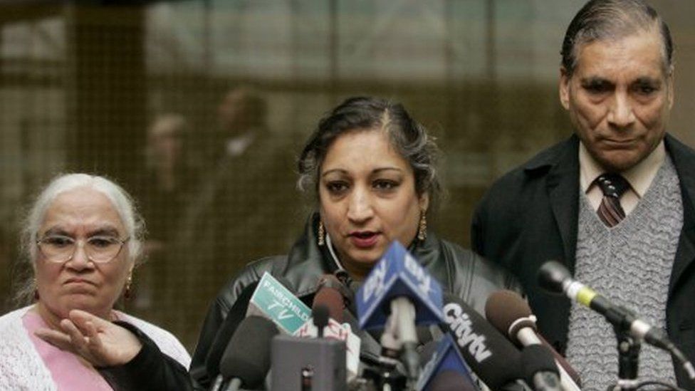 Suman Virk, centre, mother of murdered Reena Virk, talks to media outside B.C. Supreme Court in Vancouver on 12 April 2005, flanked by her mother Tarsem Pallan and father Mukand Pallan after Kelly Ellard was found guilty murdering daughter Reena Virk seven years ago
