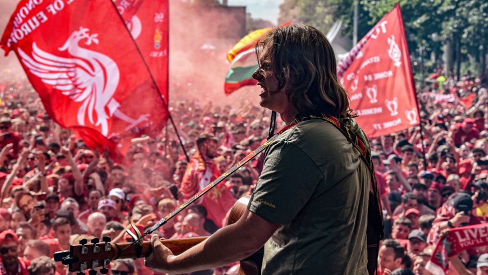 Jamie Webster performing in the fan park before the UEFA Champions League final match between Liverpool FC and Real Madrid at Stade de France on May 28, 2022