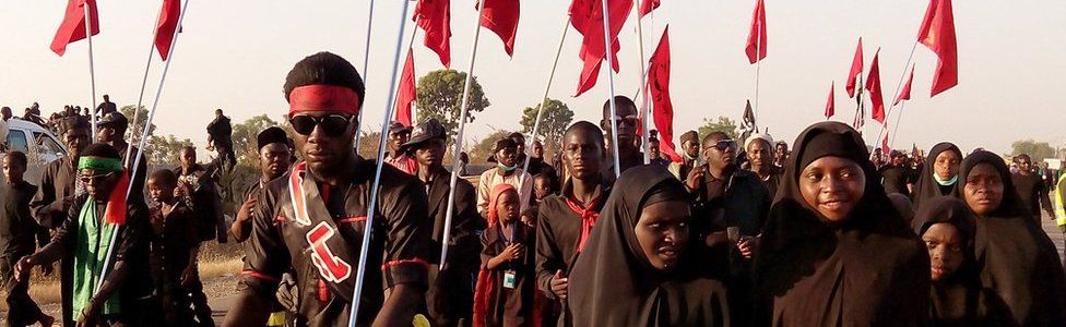 Shia Muslims march on the highway during a symbolic procession commemorating the 40th anniversary of the Ashura religious ceremony on 2 November 2015 in the village of Dakasoye, northern Nigeria