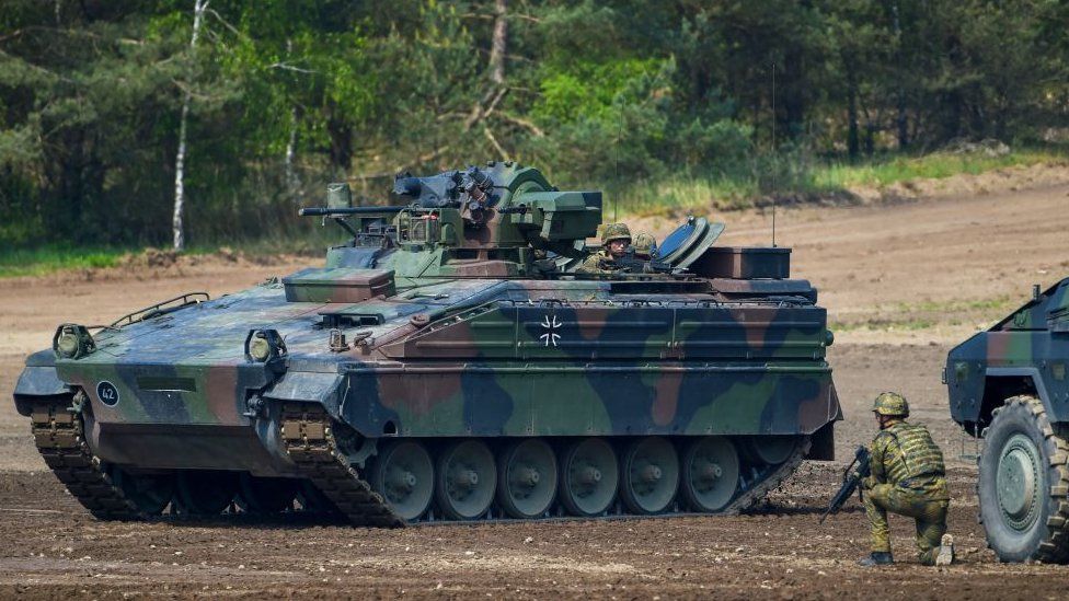 A Marder battle tank of the German armed forces Bundeswehr drives during an informative educational practice of the "Very High Readiness Joint Task Force (VJTF)", which is part of a Nato tank unit, at the military training area in Munster, northern Germany, on 20 May 2019