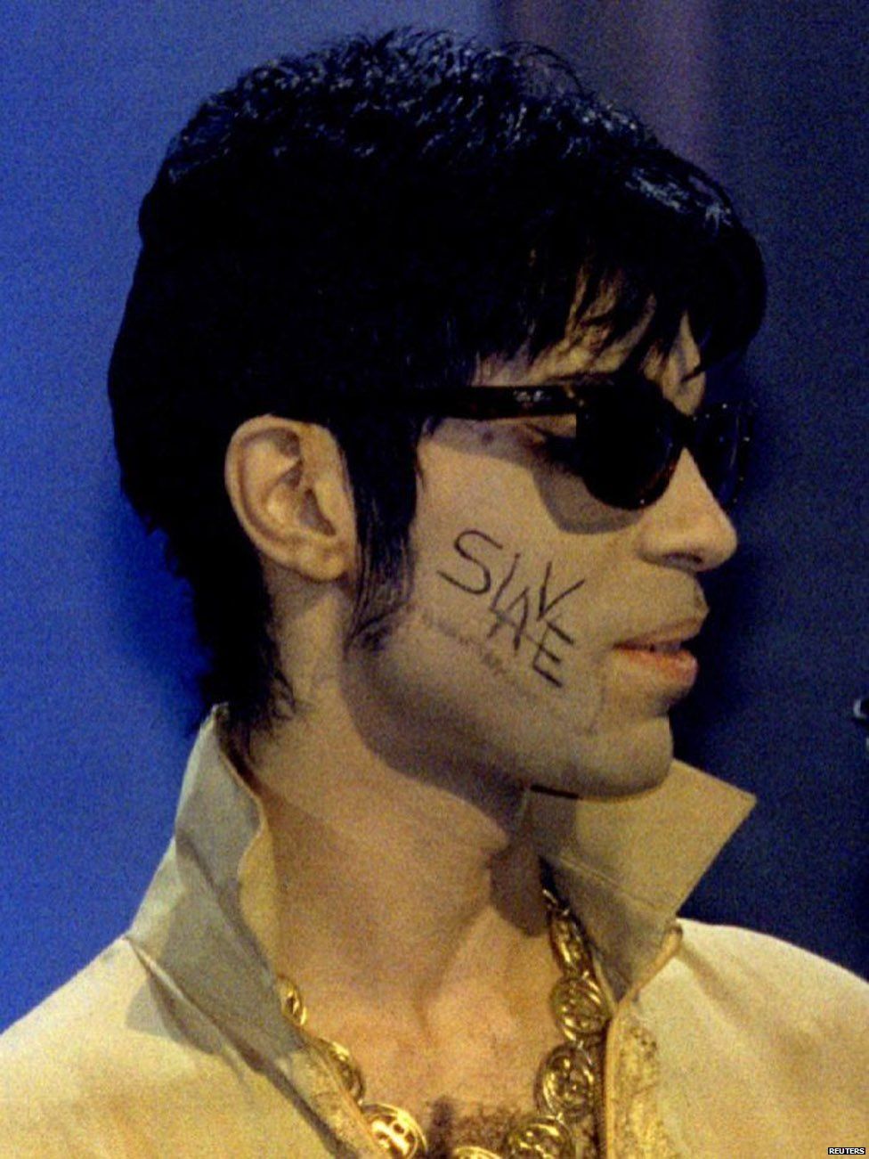Prince with "slave" on his face