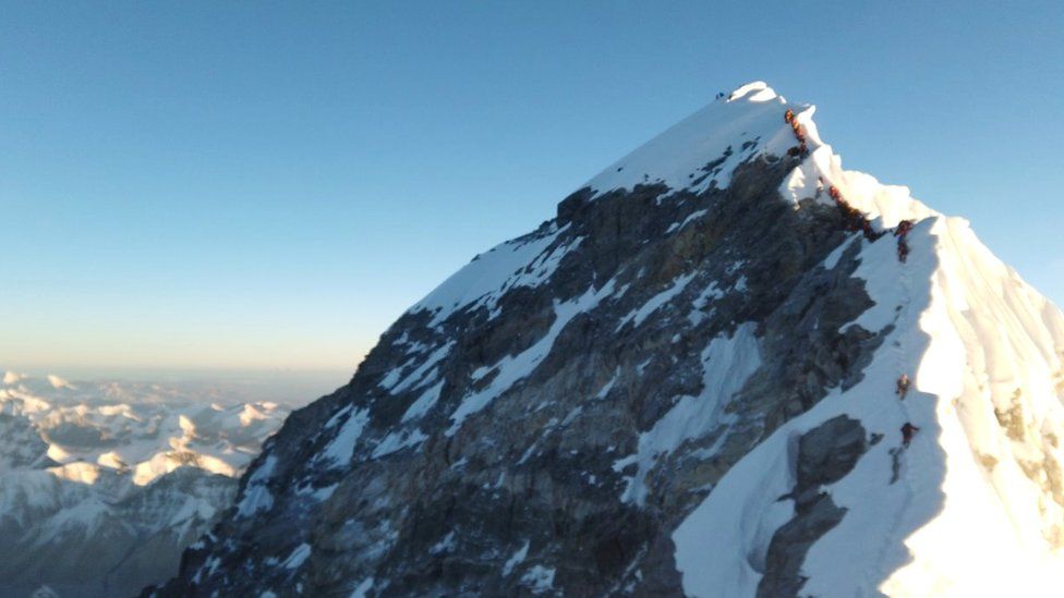 Climbers are seen on 22 May approaching summit