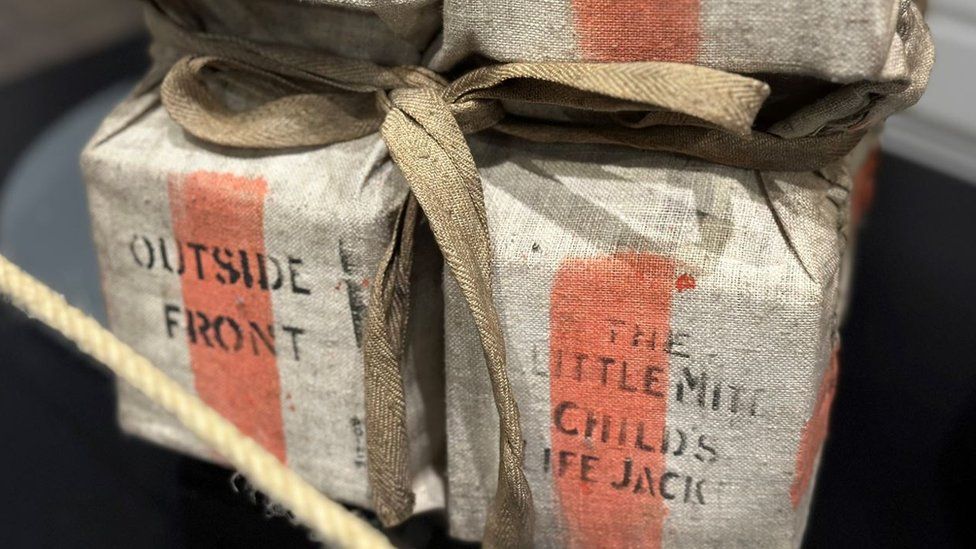 Some of the more poignant items featured include a child's lifejacket