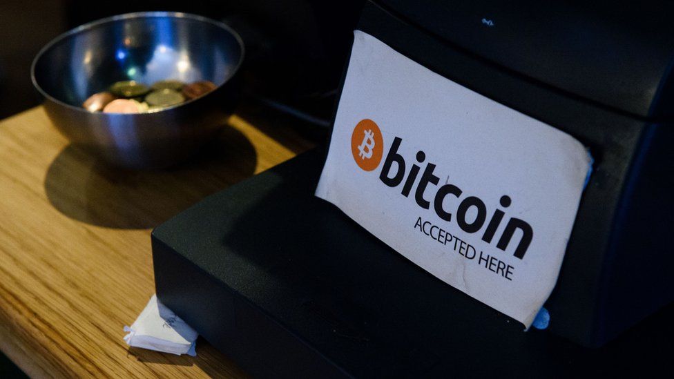 A Bitcoin sign at a cash register