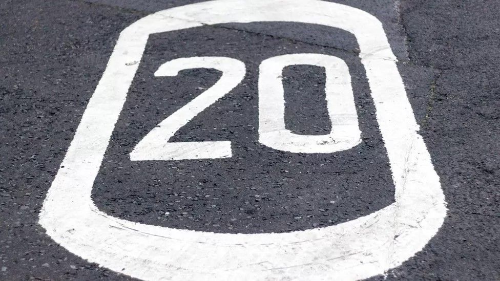 20mph sign painted on road