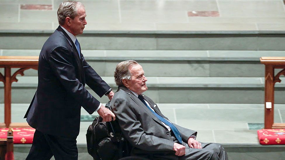 George H W Bush was pushed by his son at his wife Barbara’s funeral on 22 April 2018