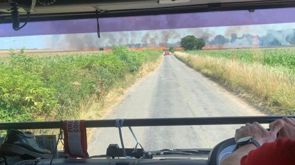 View form a fire engine as it approaches a wildfire