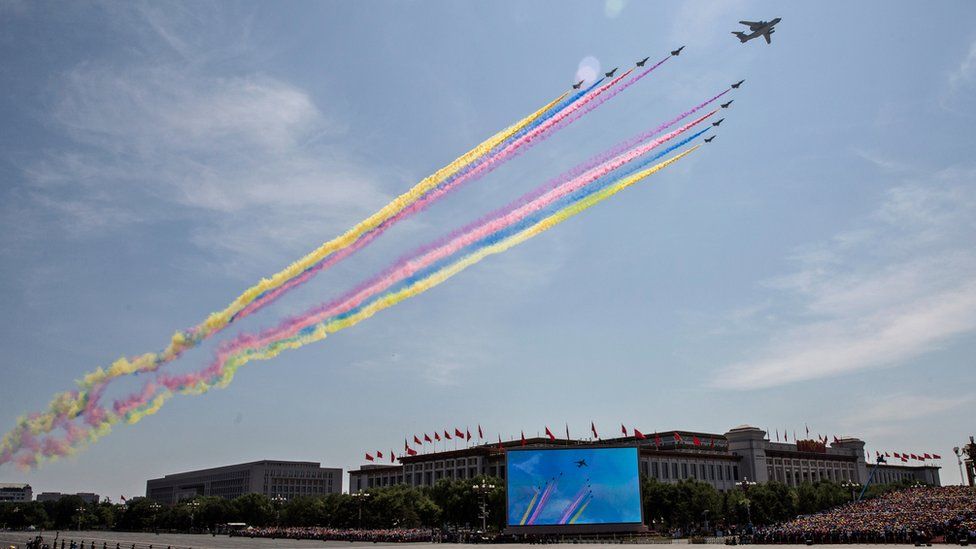 Aircraft fly in formation over Beijing releasing coloured smoke - 2015