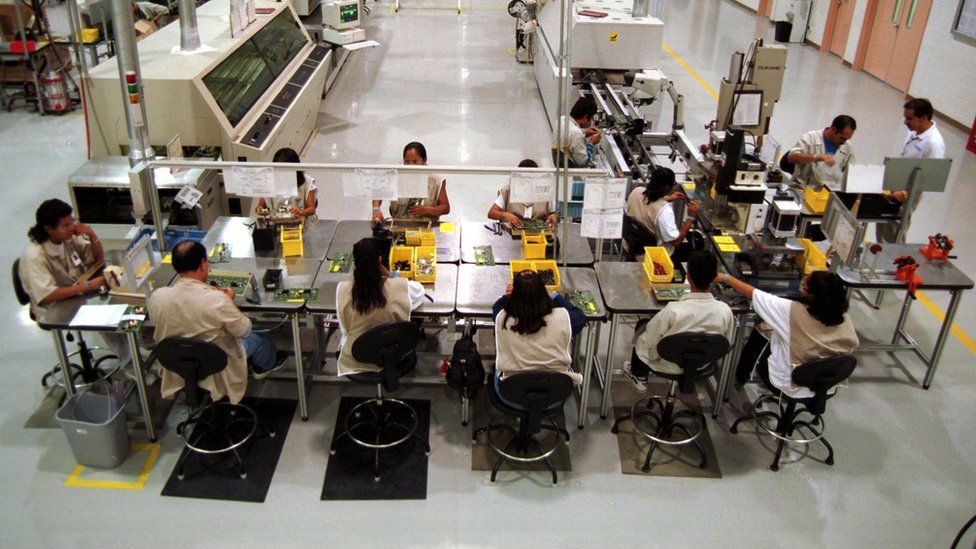Workers at an electronics factory in the Mexican border city of Ciudad Juarez