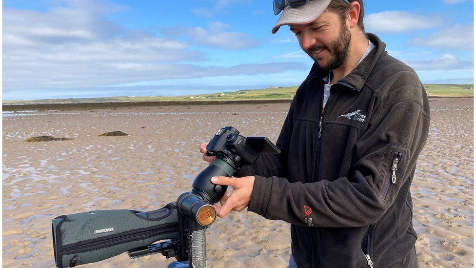 John Dickens and camera mounted on telescope