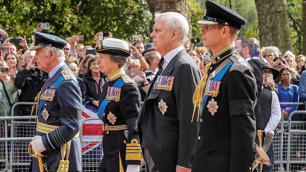 King Charles, Princess Anne, Prince Andrew and Prince Edward follow Queen Elizabeth II's coffin during a procession to Westminster Hall