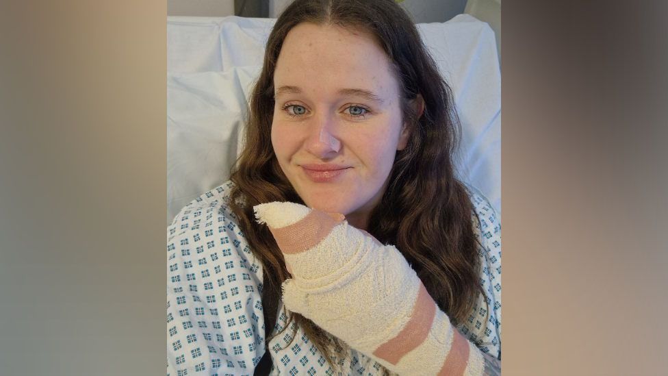 Crystal Rudd in hospital with a bandaged hand