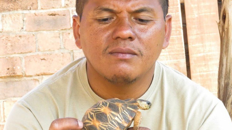 Herilala Randriamahazo, TSA's coordinator in Madagascar, with a Radiated Tortoise.