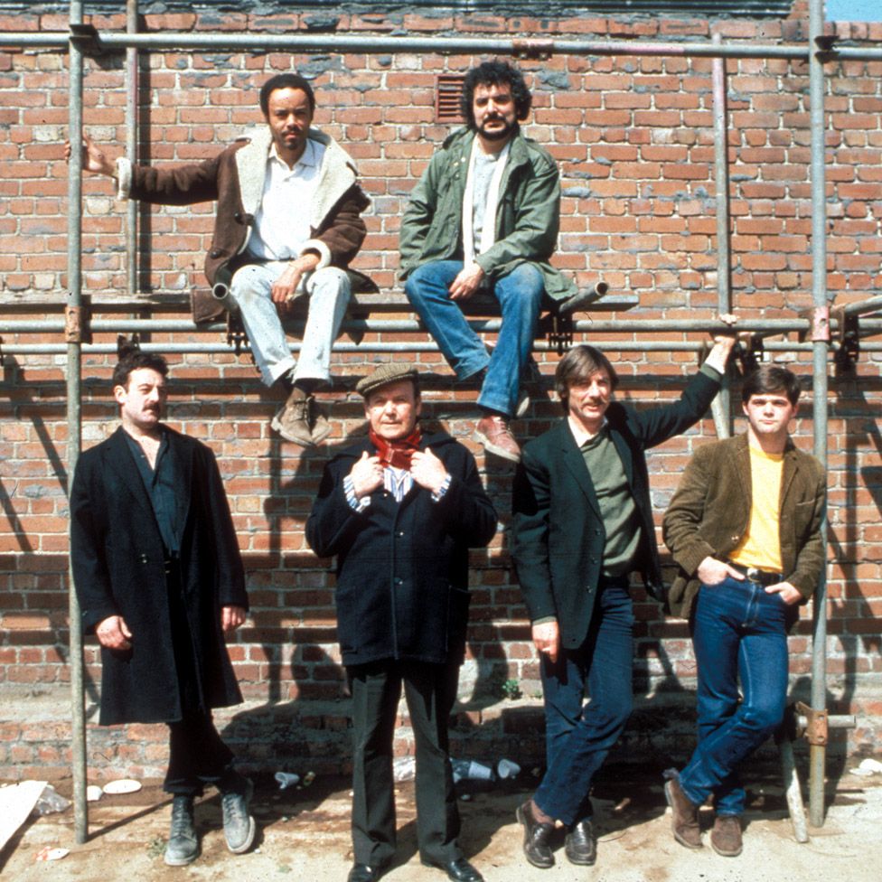 (top, l-r) Alan Igbon as Loggo, Michael Angelis as Chrissie Todd, (bottom, l-r) Bernard Hill as Yosser Hughes, Peter Kerrigan as George Malone, Tom Georgeson as Dixie Deans and Gary Bleasdale as Kevin Dean in 'Boys From the Blackstuff