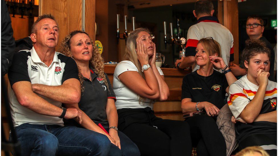 Dejected England fans at Crewe and Nantwich RFC, Nantwich.