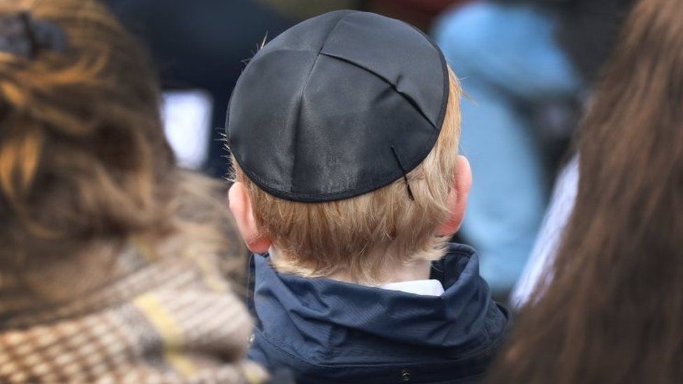 A young man wears a kippa in Bergen-Belsen, northern Germany. Photo: 18 April 2018