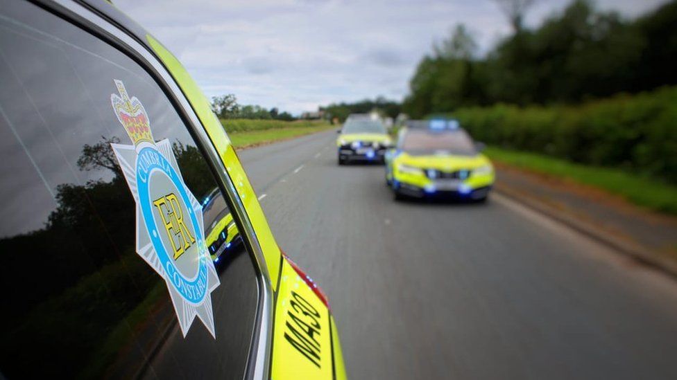 Cumbria Constabulary cars pictured on a road