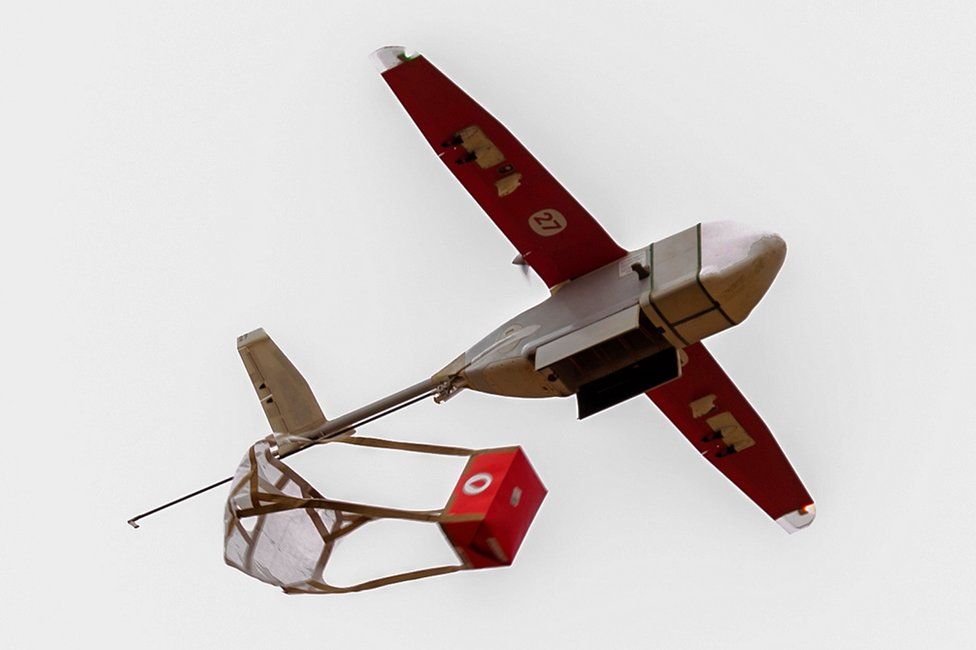 A drone in Rwanda releases a blood package during the visit of Jim Yong Kim of the World Bank Group President.