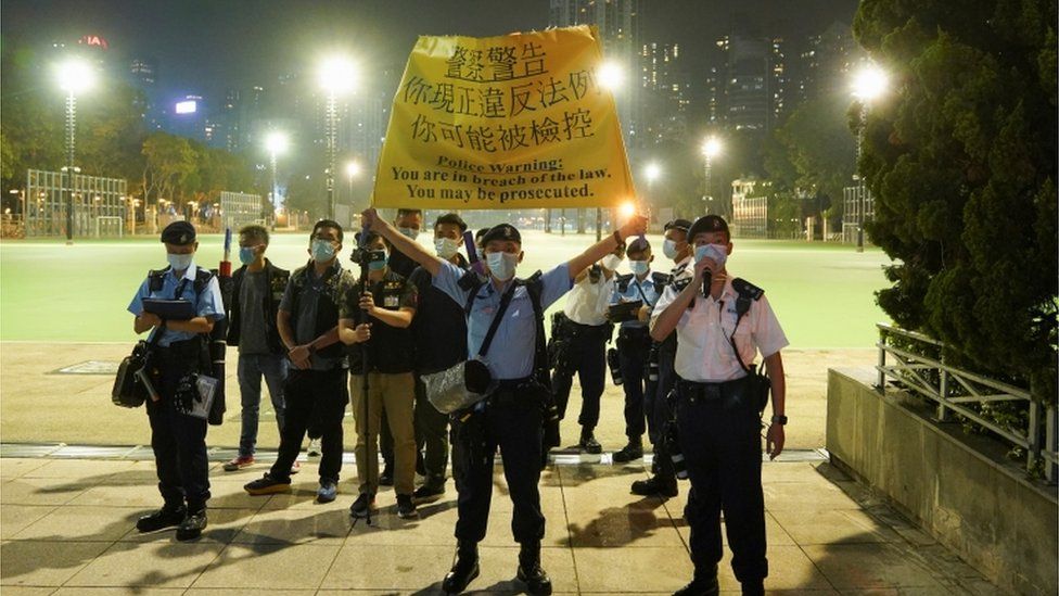 Police officers stand guard in Victoria Park, Hong Kong
