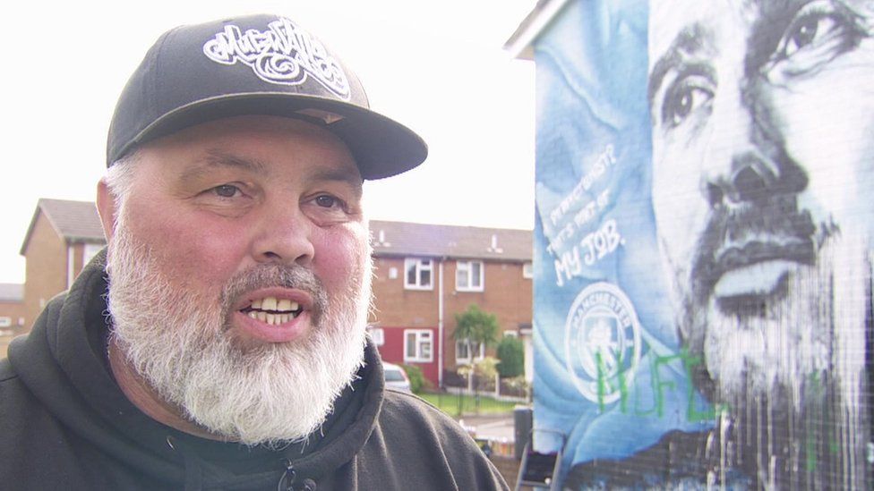 Defaced UK soccer star mural transformed into symbol of anti