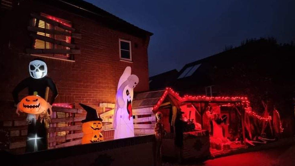Halloween decorations outside house at night