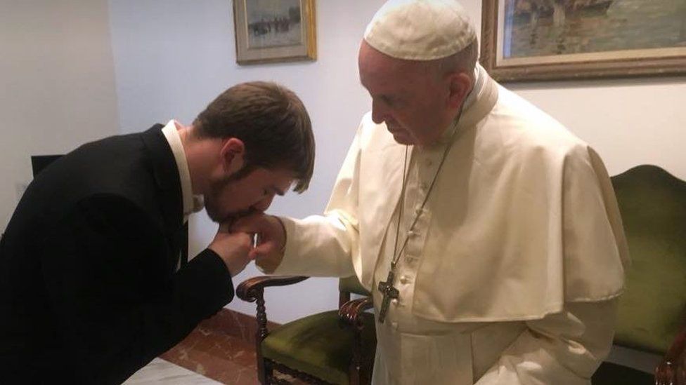 Tom Evans kissing Pope Francis' hand