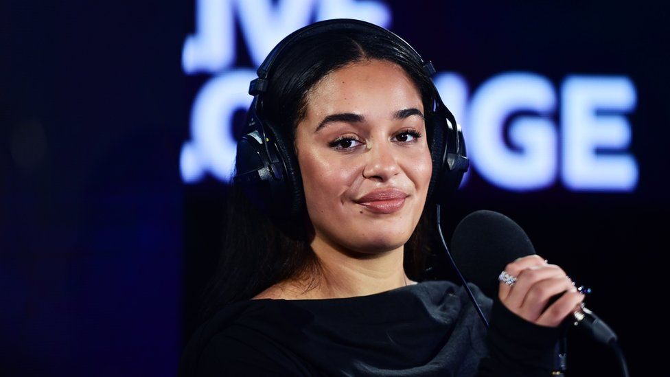 Jorja Smith with a microphone