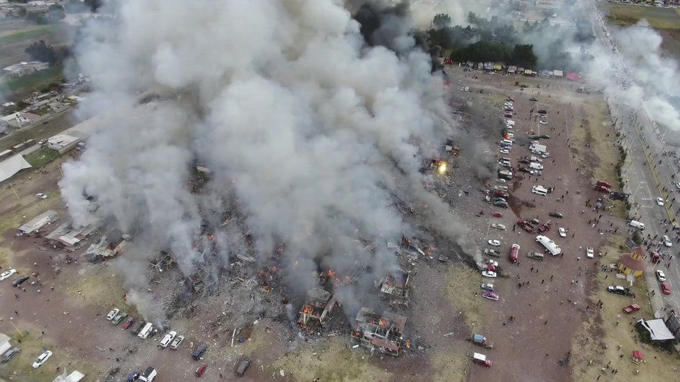 Drone footage shows smoke billowing from the San Pablito market in Tultepec, Mexico, Tuesday, Dec. 20