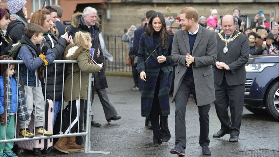 Prince Harry and Meghan Markle during a walkabout on the esplanade at Edinburgh Castle