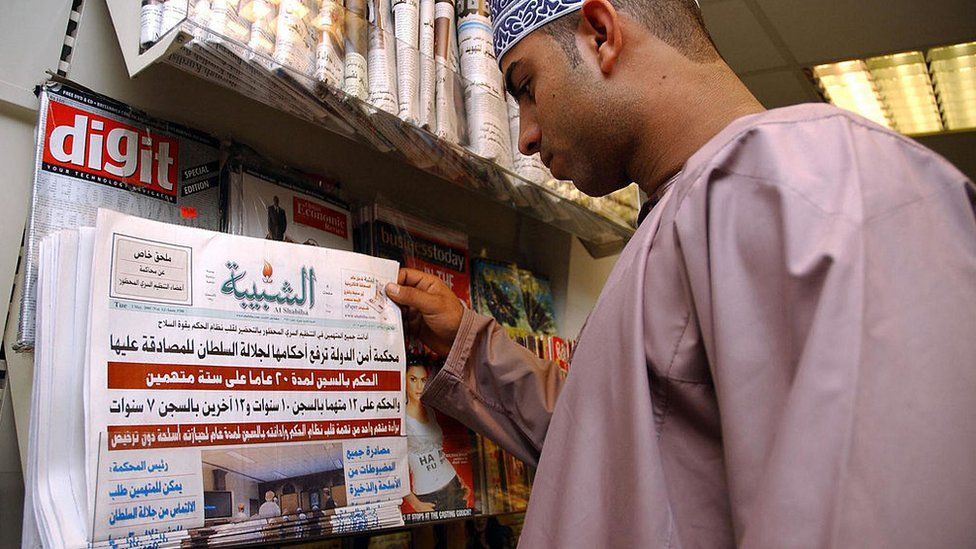 An Omani man looks at the front page of Al-Shabiba newspaper