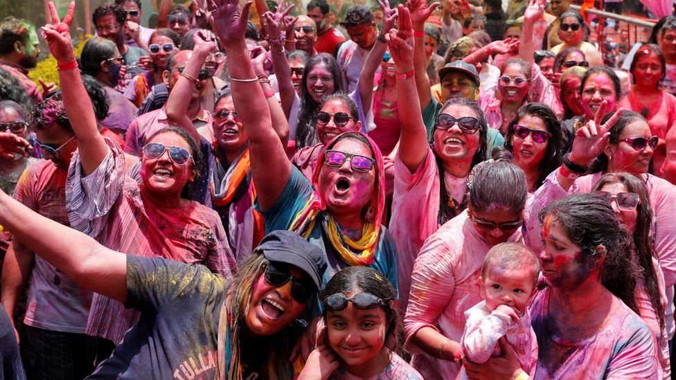 People daubed with colour powders take part in the Holi Festival celebrated as the Festival of Colours, Love, and Spring in Nairobi, Kenya March 24, 2024.