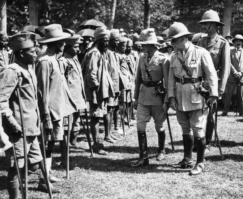 circa 1921: Edward the Prince of Wales, later King Edward VIII of Great Britain, inspecting maimed soldiers during a visit to Bombay, India.