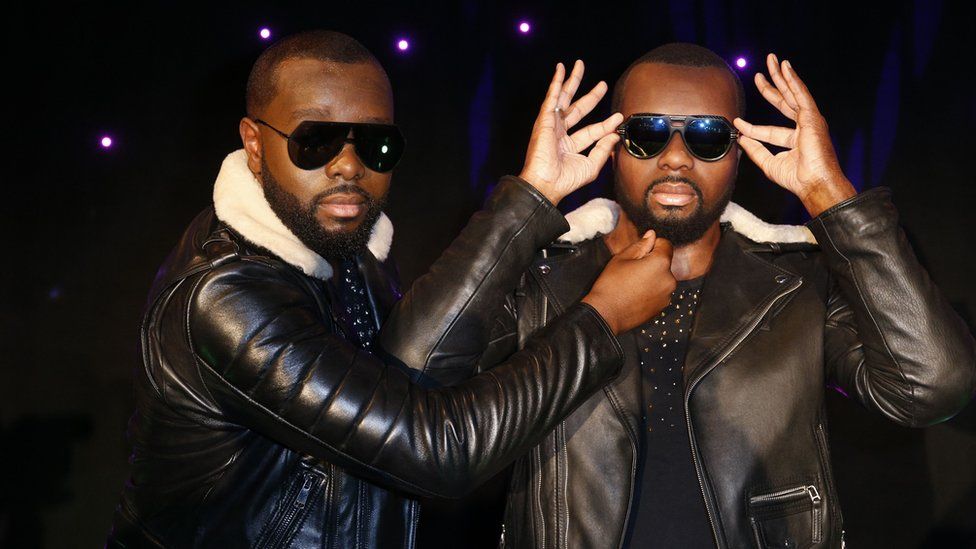 Maitre Gims pulls the beard of his wax look alike at the Musee Grevin wax museum in Paris, France - Monday 2 October 2017