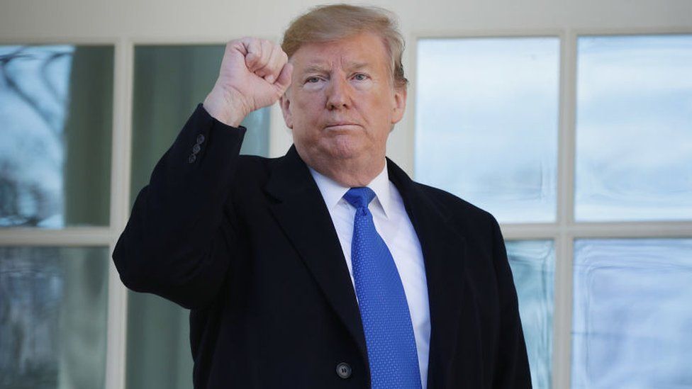 Trump gestures after speaking on border security at the Rose Garden