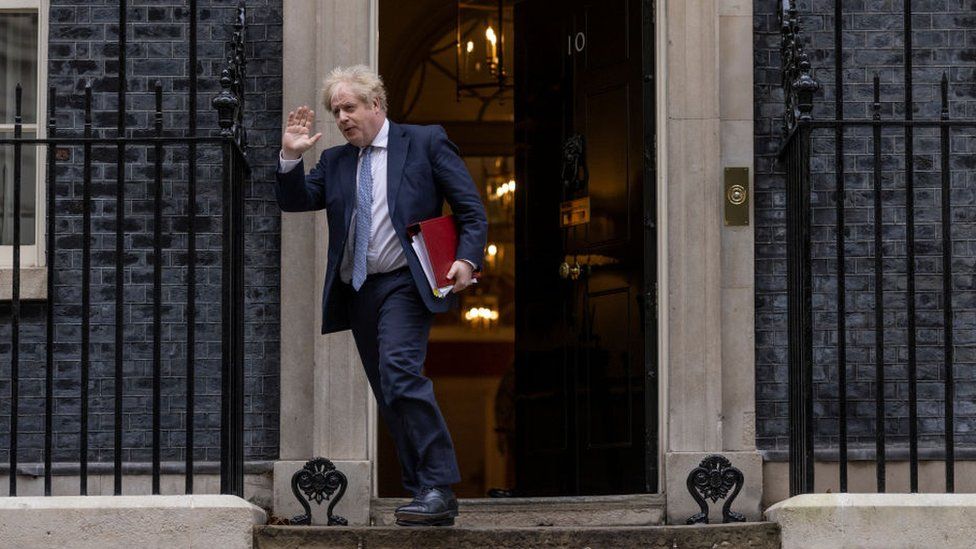 Boris Johnson leaves 10 Downing Street to attend the weekly Prime Minister's Questions